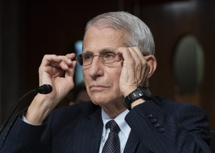 Dr. Anthony Fauci, director of the National Institute of Allergy and Infectious Diseases, adjusts his glasses during a Senate Health, Education, Labor, and Pensions Committee hearing on Capitol Hill, Thursday, Nov. 4, 2021, in Washington. (AP Photo/Alex Brandon)