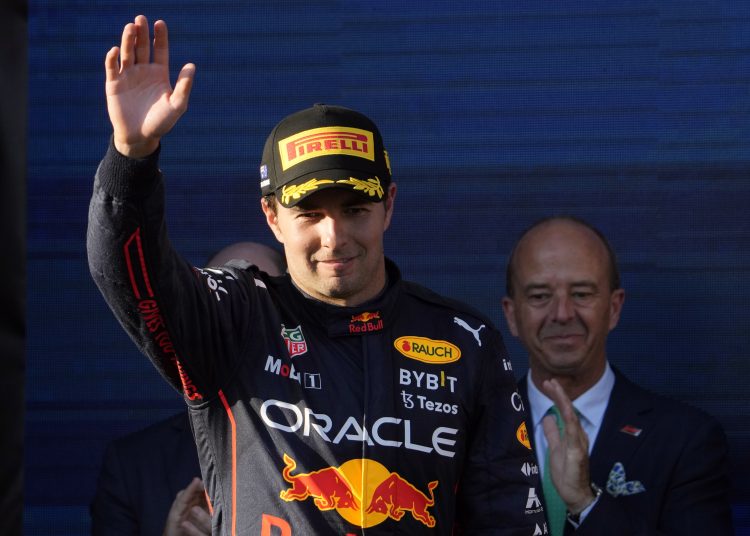 Melbourne (Australia), 10/04/2022.- Second placed Mexican Formula One driver Sergio Perez of Red Bull Racing waves on the podium after the Formula One Grand Prix of Australia at Albert Park Circuit in Melbourne, Australia, 10 April 2022. (Fórmula Uno) EFE/EPA/SIMON BAKER