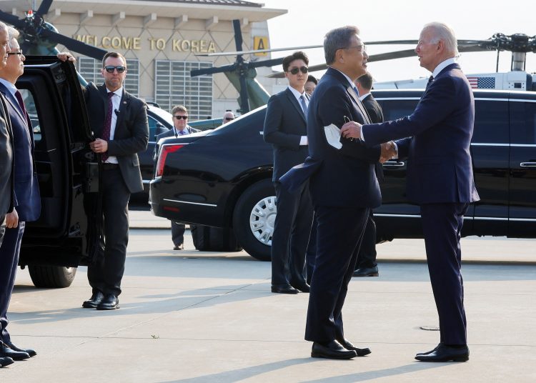 South Korea's Foreign Minister Park Jin greets U.S. President Joe Biden as he arrives at Osan Air Base (ROK) in Pyeongtaek, South Korea, May 20, 2022. REUTERS/Jonathan Ernst