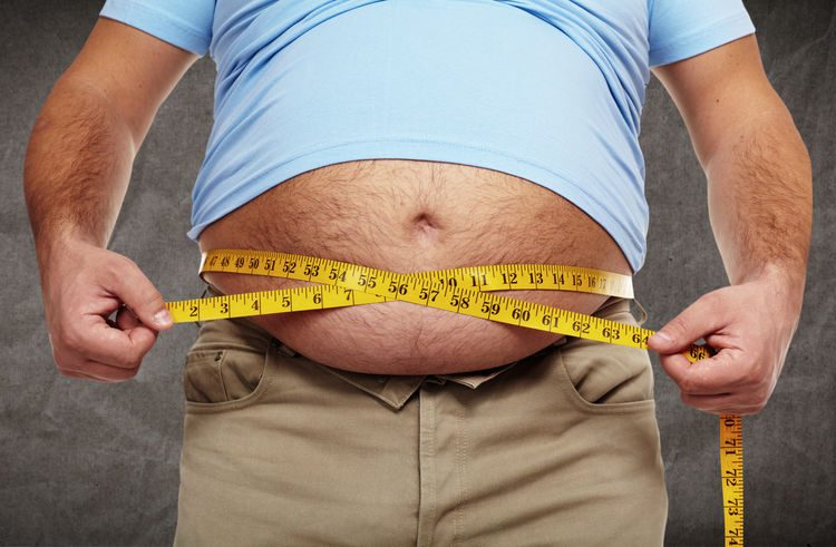 Fat belly. Man with overweight abdomen. Weight loss concept.