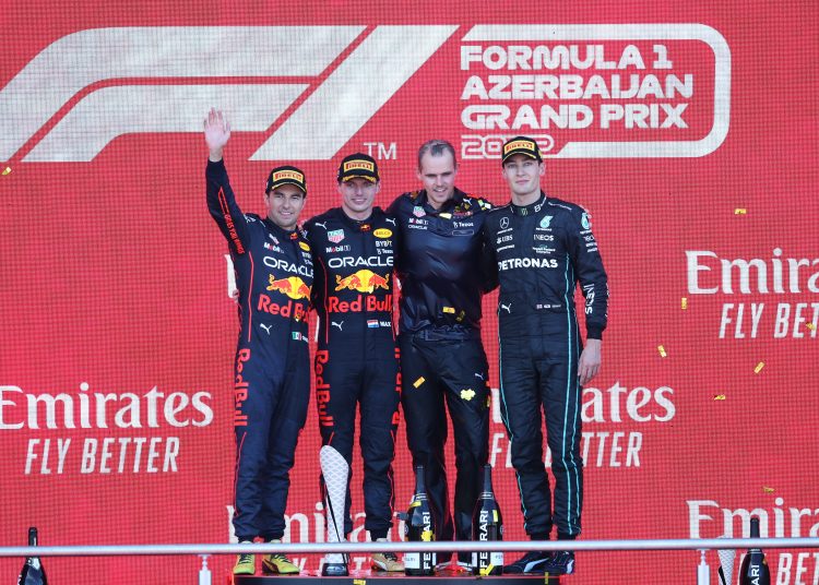 Baku (Azerbaijan), 12/06/2022.- First placed Dutch Formula One driver Max Verstappen of Red Bull Racing (C-L), second paced Mexican Formula One driver Sergio Perez of Red Bull Racing (L) and third placed British Formula One driver George Russell of Mercedes-AMG Petronas (R) celebrate on the podium after the Formula One Grand Prix of Azerbaijan at the Baku City Circuit in Baku, Azerbaijan, 12 June 2022. (Fórmula Uno, Azerbaiyán) EFE/EPA/ALI HAIDER
