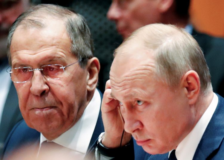 Russian President Vladimir Putin and Russia's acting Foreign Minister Sergei Lavrov attend the Libya summit in Berlin, Germany, January 19, 2020.  REUTERS/Hannibal Hanschke/Pool