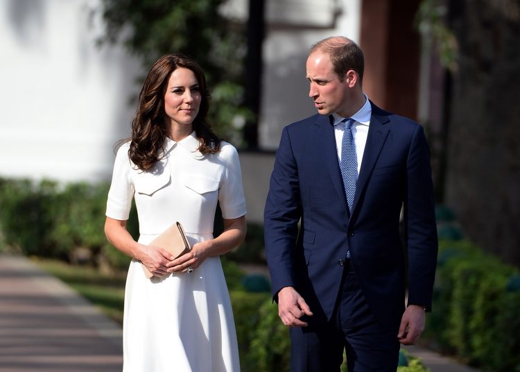 Britain's Prince William, along with his wife Kate, the Duchess of Cambridge walk as they pay tribute during a visit to Gandhi Smiriti, an Indian museum dedicated to Mahatma Gandhi in New Delhi, Monday, April 11, 2016. (Prakash Singh/Pool photo via AP)