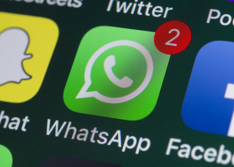 London, UK - July 31, 2018: The buttons of WhatsApp, Facebook, Twitter and other apps on the screen of an iPhone.
