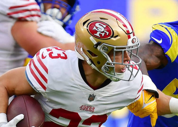 Oct 30, 2022; Inglewood, California, USA; San Francisco 49ers running back Christian McCaffrey (23) runs the ball against Los Angeles Rams linebacker Leonard Floyd (54) during the first half at SoFi Stadium. Mandatory Credit: Gary A. Vasquez-USA TODAY Sports