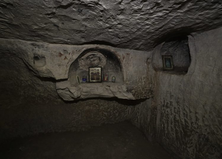Lachish Forest (Israel), 20/12/2022.- Christian religious icons left by recent visitors are placed in a niche of a Second Temple-period burial cave in Lachish Forest, 20 December 2022, during excavations on the site of a grave estate from the days of the Second Temple (about 2,000 years ago), that was discovered in the South of Israel. According to Israel Antiques Authority (IAA) archaeologists, the burial cave that was continued to be used in the Byzantine and Early Islamic periods, became known as the 'Salome Cave', due to a popular legend that identified it as the burial place of Salome, the midwife of Jesus. The excavations in the courtyard uncovered a row of shop stalls that, according to the excavators, sold or rented clay lamps. 'In the shop, we found hundreds of complete and broken lamps dating from the 8thñ9th centuries CE,' the experts said. EFE/EPA/ATEF SAFADI ATTENTION: This Image is part of a PHOTO SET