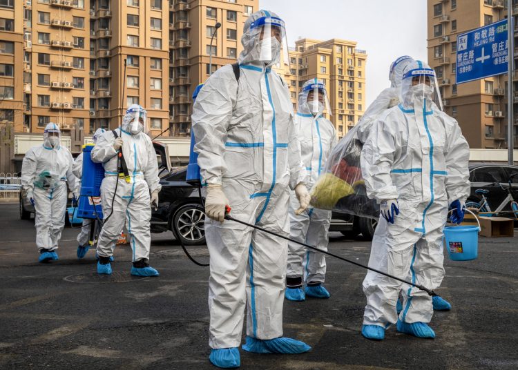 Workers in protective gear at a neighborhood placed under lockdown due to Covid-19 in Beijing, China, on Thursday, Nov. 10, 2022. Chinese stocks dropped as the nation increased Covid restrictions to curb an outbreak in a key manufacturing hub, dampening hopes of a reopening that have triggered a rally this month. Source: Bloomberg