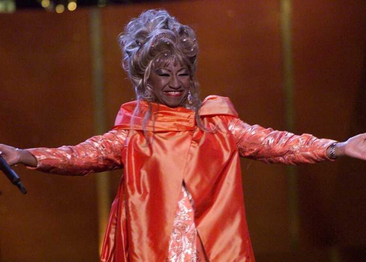 Cuban salsa singer Celia Cruz (1924 - 2003) onstage performing at 'VH1 Divas Live: The One and Only Aretha Franklin' held at Radio City Music Hall in New York City, April 10, 2001. (Photo by Scott Gries/Getty Images)
