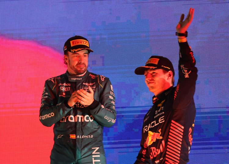 Sakhir (Bahrain), 05/03/2023.- Dutch Formula One driver Max Verstappen of Red Bull Racing (R) and Spanish Formula One driver Fernando Alonso of Aston Martin (L) celebrate on the podium after the Formula One Grand Prix of Bahrain at the Bahrain International Circuit in Sakhir, Bahrain, 05 March 2023. (Fórmula Uno, Bahrein) EFE/EPA/Ali Haider