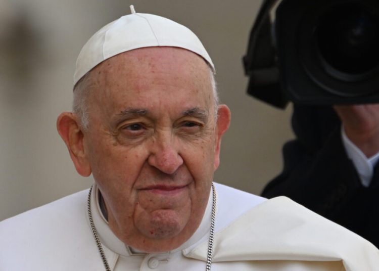 Pope Francis arrives in the popemobile car for the weekly general audience on March 22, 2023 at St. Peter's square in The Vatican. (Photo by Andreas SOLARO / AFP)