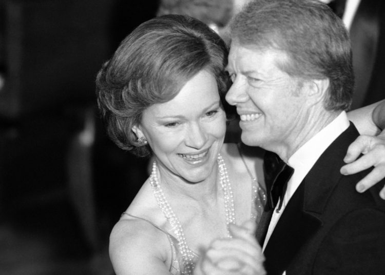 President Jimmy Carter and his wife Rosalynnr lead their guests in dancing at the annual Congressional Christmas Ball at the White House in Washington on Tuesday, Dec. 13, 1978. (AP Photo/Ira Schwarz)