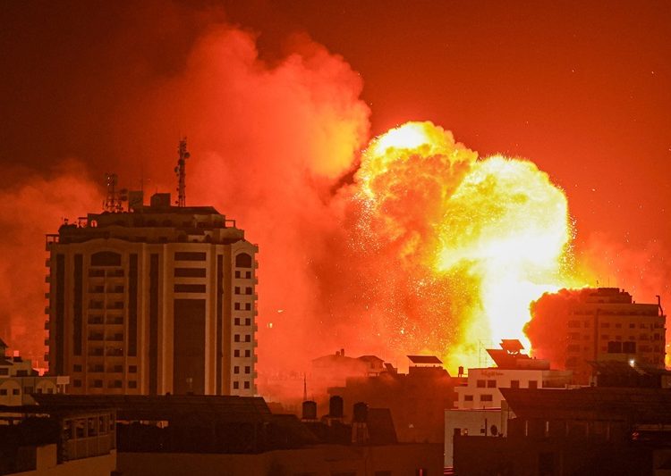 TOPSHOT - A fireball erupts from an Israeli airstrike in Gaza City on October 9, 2023.  (Photo by MAHMUD HAMS / AFP) (Photo by MAHMUD HAMS/AFP via Getty Images)