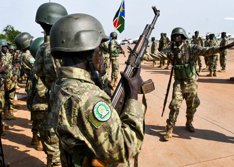 Members of South Sudan People's Defence Forces (SSPDF), part of the troops of the East Africa Community Regional Force (EACRF), sing before departing on their deployment as part of a regional military operation targeting rebels, at the Juba International Airport in Juba, South Sudan April 3, 2023. REUTERS/Samir Bol