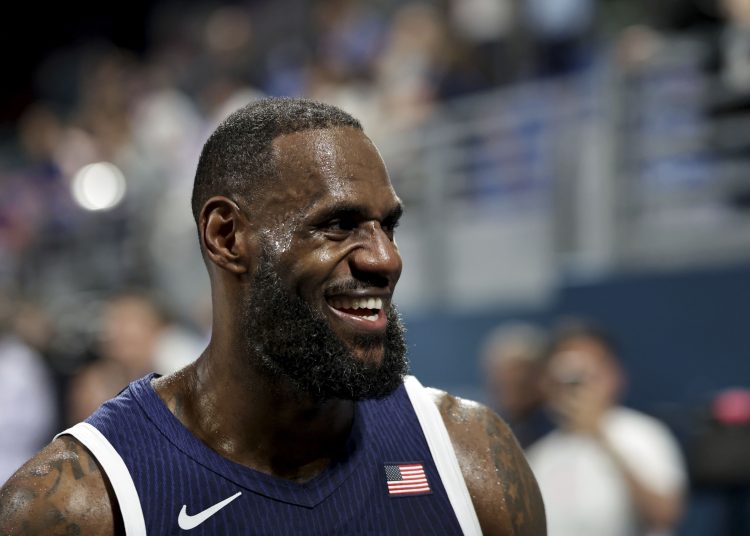 epa11503723 Lebron James of USA reacts after the Men Basketball Group C match between Serbia and USA in the Paris 2024 Olympic Games, at the Pierre Mauroy Stadium in Villeneuve-d'Ascq, France, 28 July 2024. EPA-EFE/ALEX PLAVEVSKI