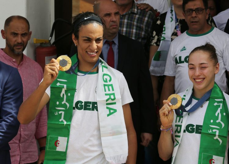 Algiers (Algeria), 12/08/2024.- Paris Olympics Gold medal winner in the Women's 66kg Boxing competition Imane Khelif (L) and Gold medal winner in the Women's Uneven Bars competition Kaylia Nemour (R) pose with their medals upon their arrival at the International Airport in Algiers, Algeria, 12 August 2024. Algeria participated with 46 athletes (27 men, 19 women) in the Paris 2024 Olympic Games, competing in 15 disciplines. They achieved three medals, including two gold and one bronze. (Argel) EFE/EPA/STRINGER