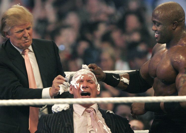 WWE chairman Vince McMahon (C) has his head shaved by Donald Trump (L) and Bobby Lashley (R) after losing a bet in the Battle of the Billionaires at the 2007 World Wrestling Entertainment's Wrestlemania in Detroit, Michigan.