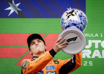 McLaren driver Oscar Piastri of Australia lifts his trophy after winning the Formula One