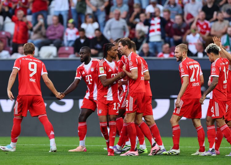 Michael Olise of Bayern Munich (C) celebrates with teammates after scoring the 0-3 goal during the German Bundesliga