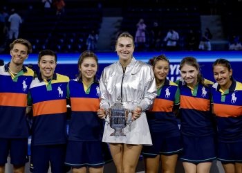 Aryna Sabalenka (C), of Belarus poses with the ball