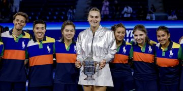 Aryna Sabalenka (C), of Belarus poses with the ball