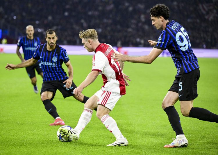 Henrikh Mkhitaryan (L) of Internazionale, Oliver Edvardsen (C) of Ajax and Alessandro Bastoni of Inter