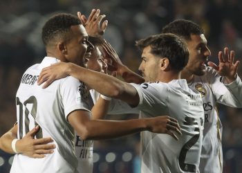 Kylian Mbappe (L) of Real Madrid celebrates with his teammates after scoring