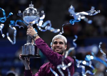 Carlos Alcaraz of Spain poses with his trophy after winning the final match against Taylor