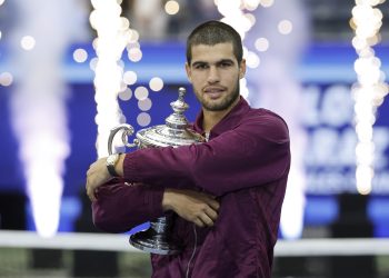Carlos Alcaraz of Spain poses with the Champions trophy