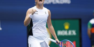 Iga Swiatek of Poland gestures after winning match point against