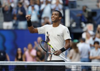 Felix Auger Aliassime of Canada celebrates after winning against Alex de Minaur
