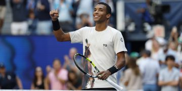 Felix Auger Aliassime of Canada celebrates after winning against Alex de Minaur