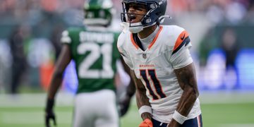 Denver Broncos wide receiver Troy Franklin (R) reacts