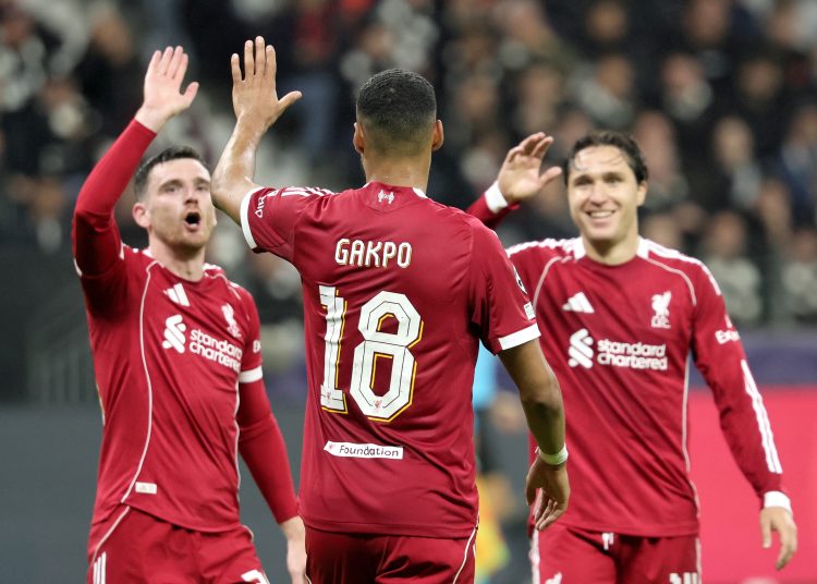 Liverpool celebrates with teanmmates after scoring his team's 4th goal during the UEFA Champions League