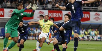 Brazil’s Joelinton (C) competes for the ball during the international friendly soccer match between Japon