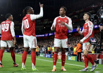 Arsenal celebrates with teammates after scoring