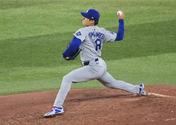 Los Angeles Dodgers pitcher Yoshinobu Yamamoto winds up for a pitch against