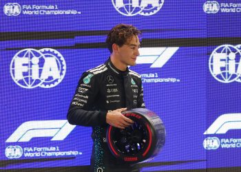 Mercedes driver George Russell of Britain poses with his Pirelli Pole Position