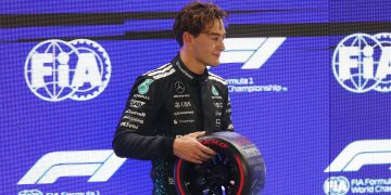 Mercedes driver George Russell of Britain poses with his Pirelli Pole Position
