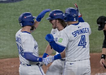 Toronto Blue Jays pinch hitter Addison Barger (C) celebrates with Nathan Lukes