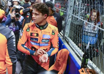 McLaren driver Lando Norris of Britain reacts on the grid prior