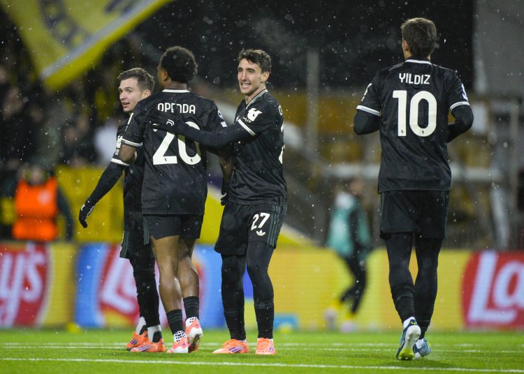 Juventus' Lois Openda (2-L) and Andrea Cambiaso (3-L) react after the 1-1 goal during the UEFA Champions