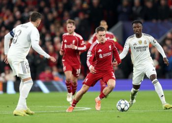 Liverpool in action against Federico Valverde (L) and Eduardo Camavinga of Real Madrid during the UEFA Champions League