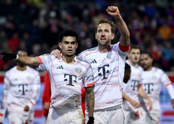 Luis Diaz of Bayern Munich (L) celebrates with teammate Harry Kane after scoring the 0-3 goal during the German
