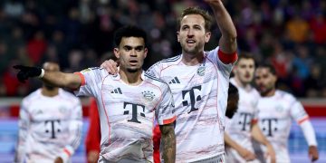 Luis Diaz of Bayern Munich (L) celebrates with teammate Harry Kane after scoring the 0-3 goal during the German