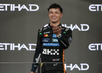 hird placed McLaren driver Lando Norris of Britain celebrates on the podium winning the 2025 Formula 1