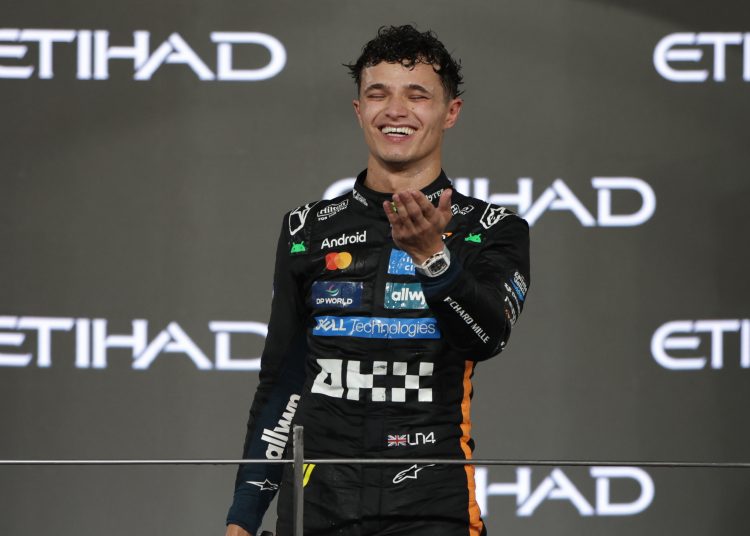 hird placed McLaren driver Lando Norris of Britain celebrates on the podium winning the 2025 Formula 1