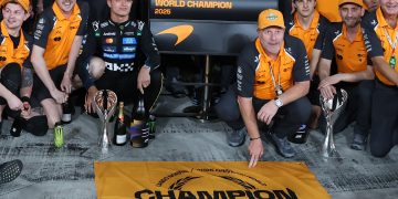 McLaren driver Lando Norris (C-L) of Britain poses with McLaren Racing CEO Zak Brown