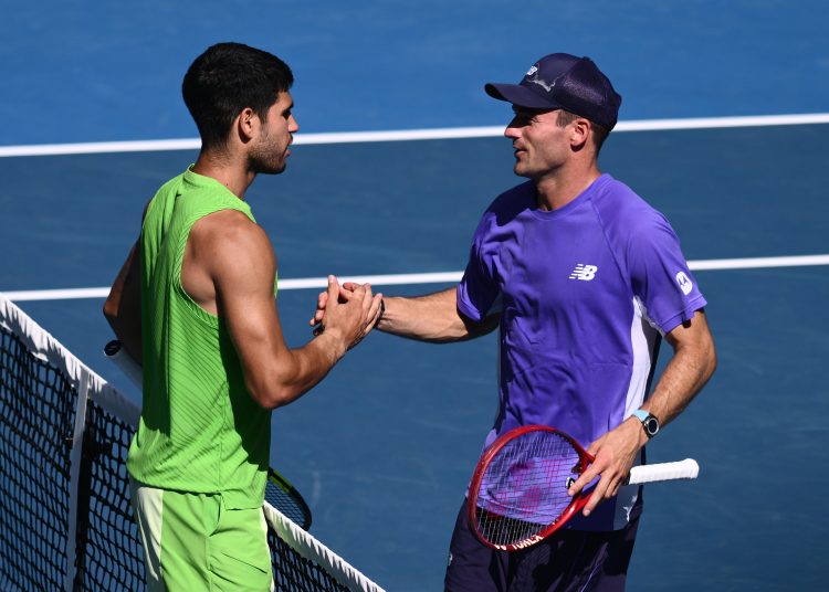 Carlos Alcaraz of Spain reacts with opponent Tommy Paul of USA