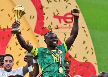 Sadio Mane of Senegal celebrates holding the trophy after winning the CAF Africa Cup of Nations after the final match between Senegal