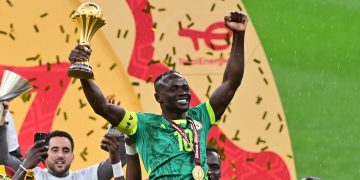 Sadio Mane of Senegal celebrates holding the trophy after winning the CAF Africa Cup of Nations after the final match between Senegal